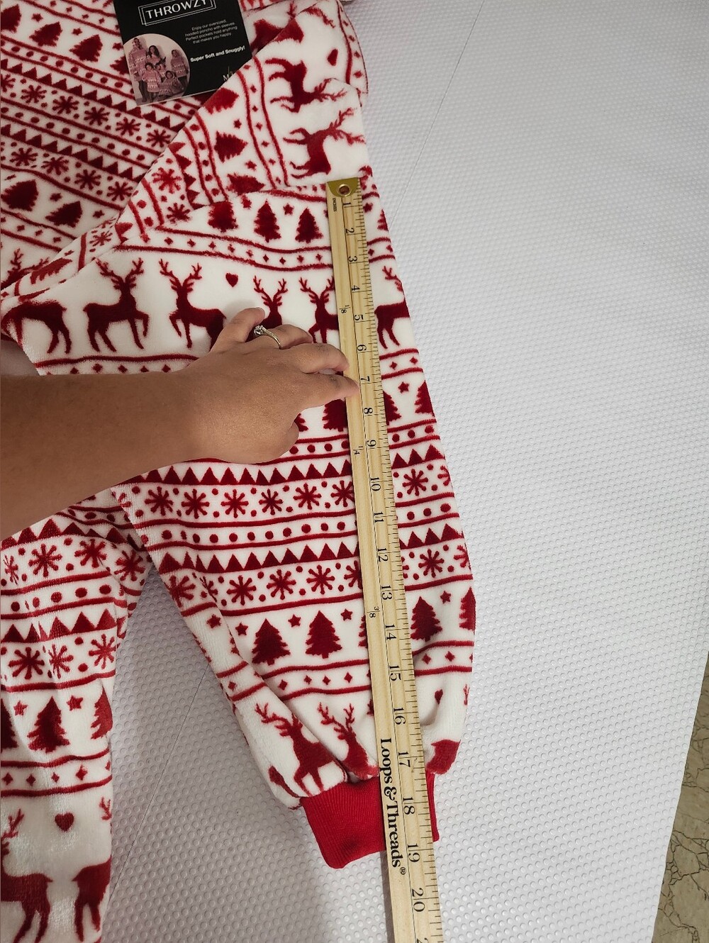 Throwzy wearable blanket hoodie features a red and white reindeer holiday patter - Picture 10 of 12